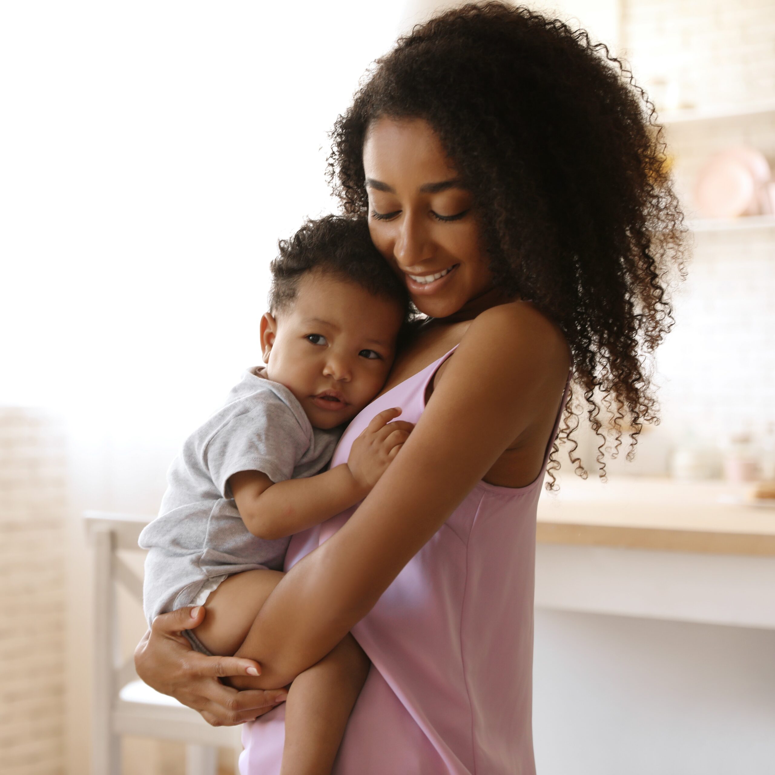 African-american Woman With Her Baby At Home. Happiness Of Motherhood A woman in North Carolina wondering "How Late Can You Take the Abortion Pill?"