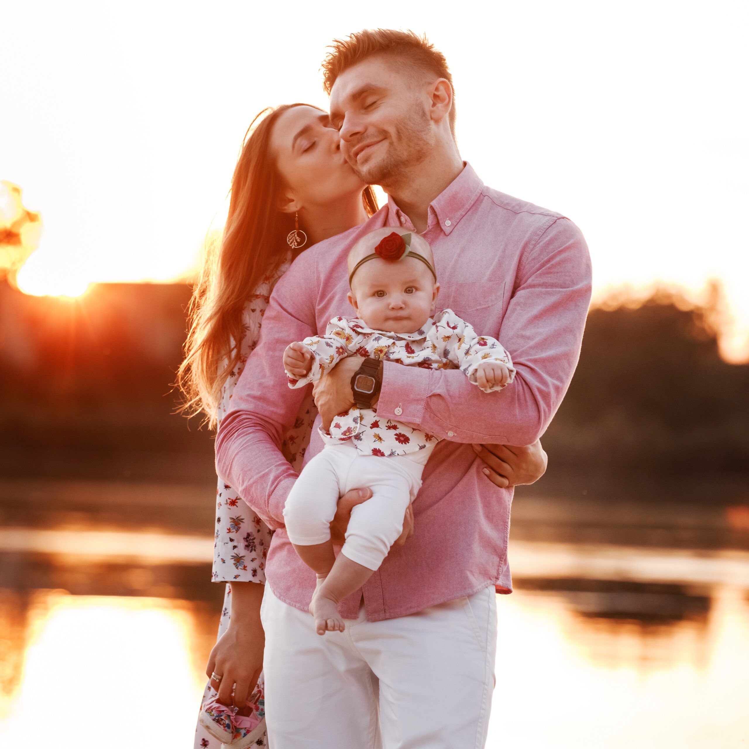 bigstock-Happy-Young-Family-Near-Lake--368713663